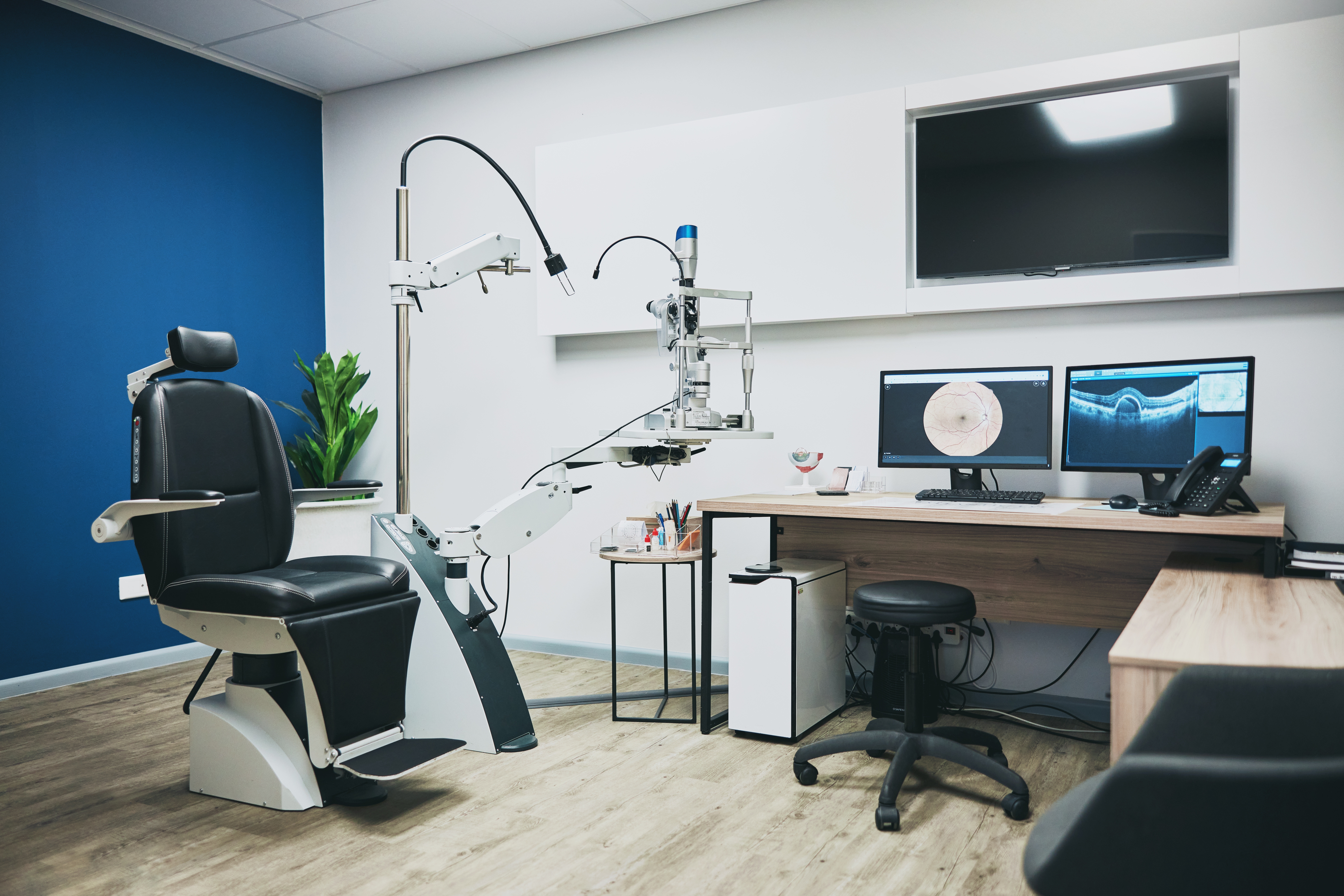 optometry room with empty patient seat for ophthalmology