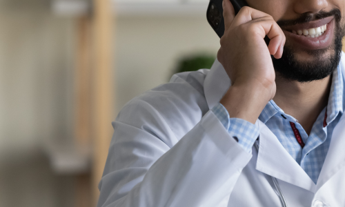 Male clinician on the phone