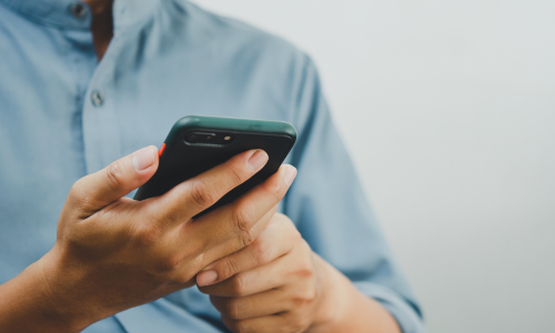 Male clinician using smartphone