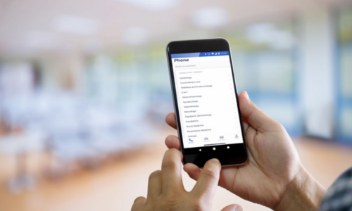 Clinician on smartphone using the Consultant Connect App