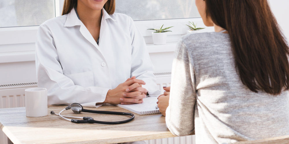 Female clinician speaking with patient