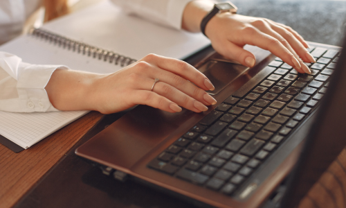 Consultant typing on computer