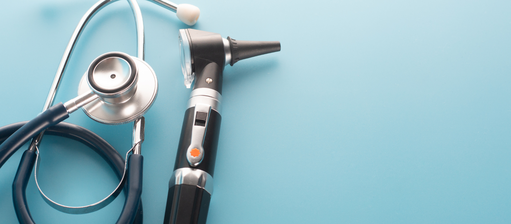 Stethoscope and Otoscope on blue background