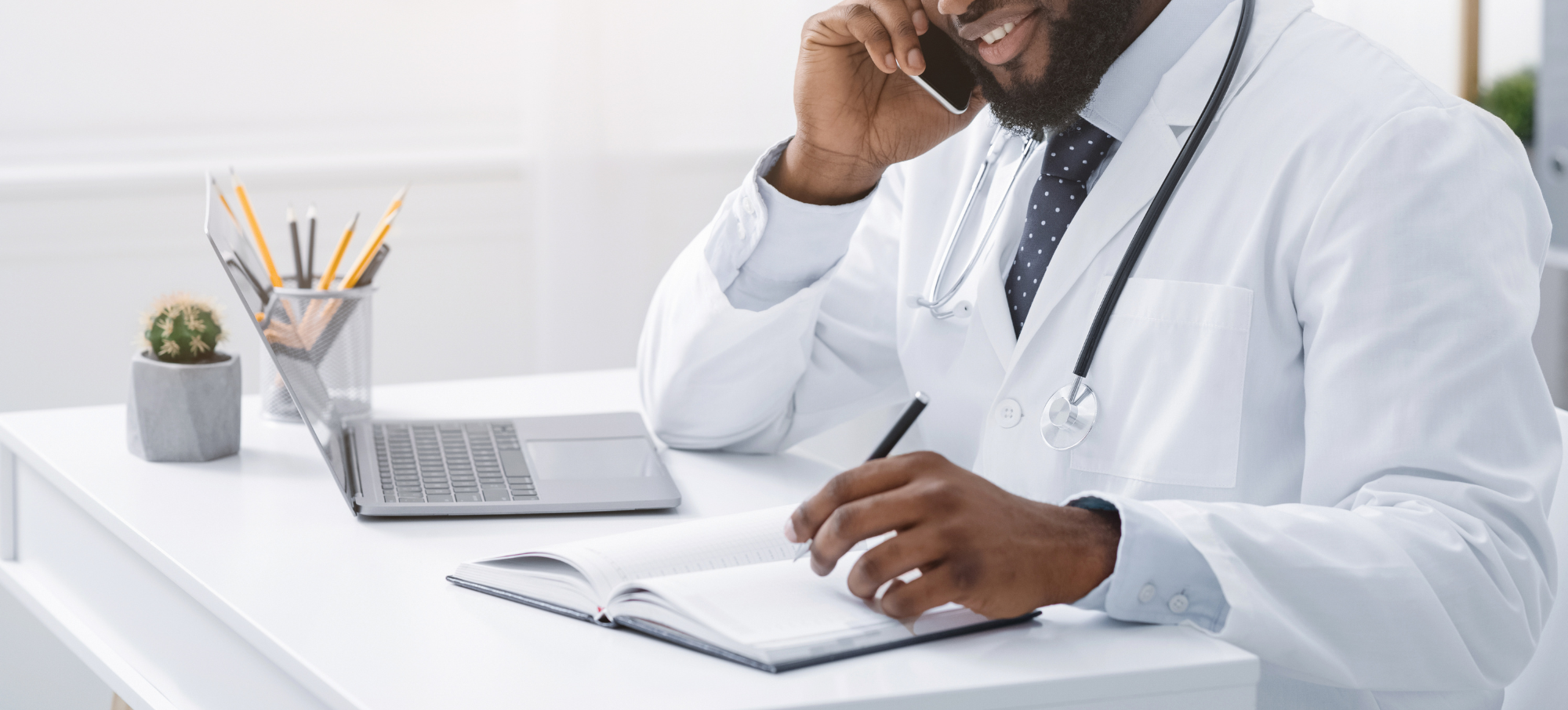 Male clinician on the phone