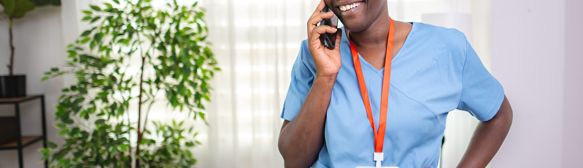 GP trainee on the phone in Tameside, Greater Manchester