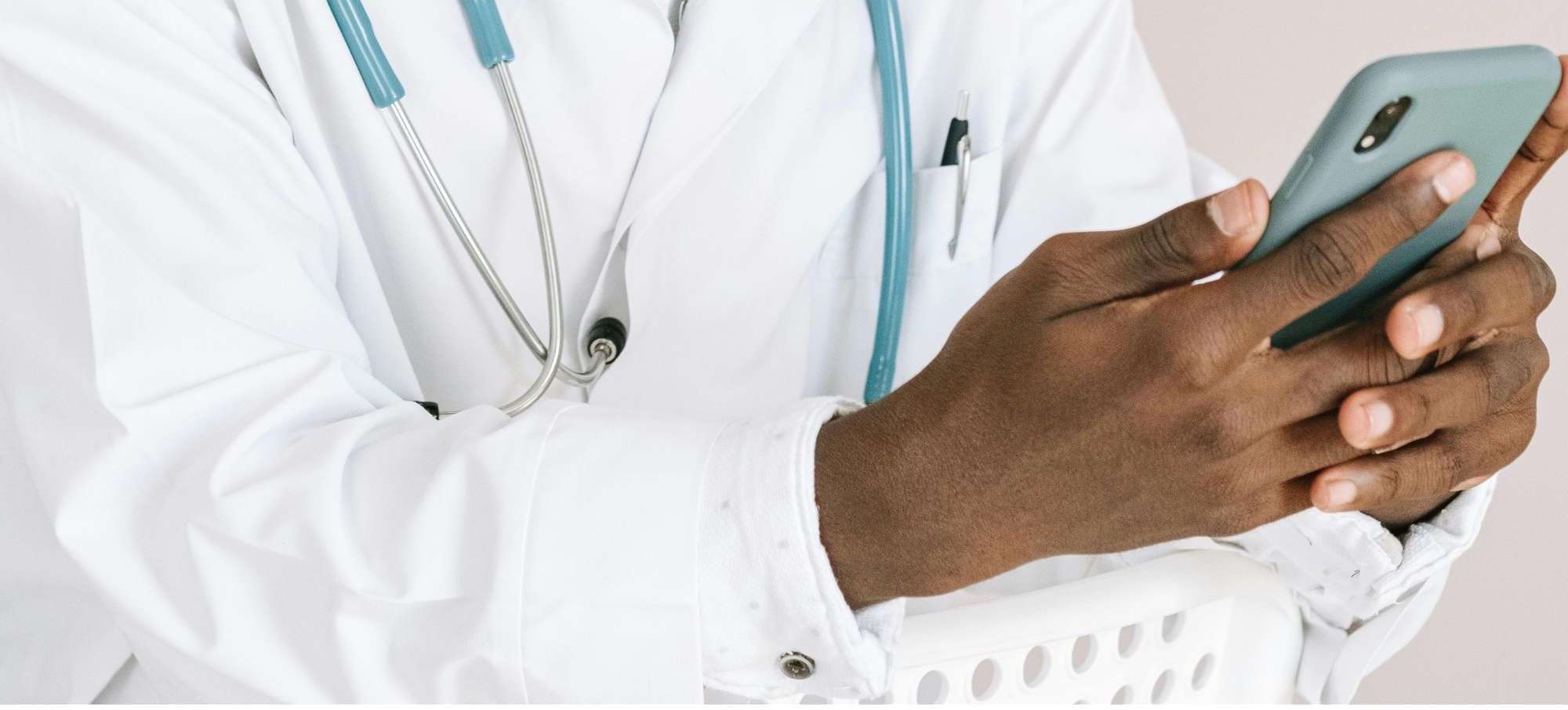 clinician sends message on smartphone