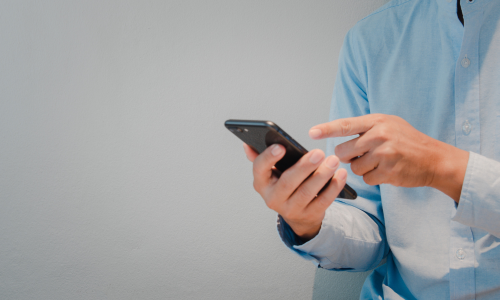 Male clinician on smartphone